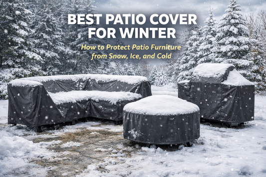 Snow-covered patio furniture protected by dark gray winter covers in a snowy backyard