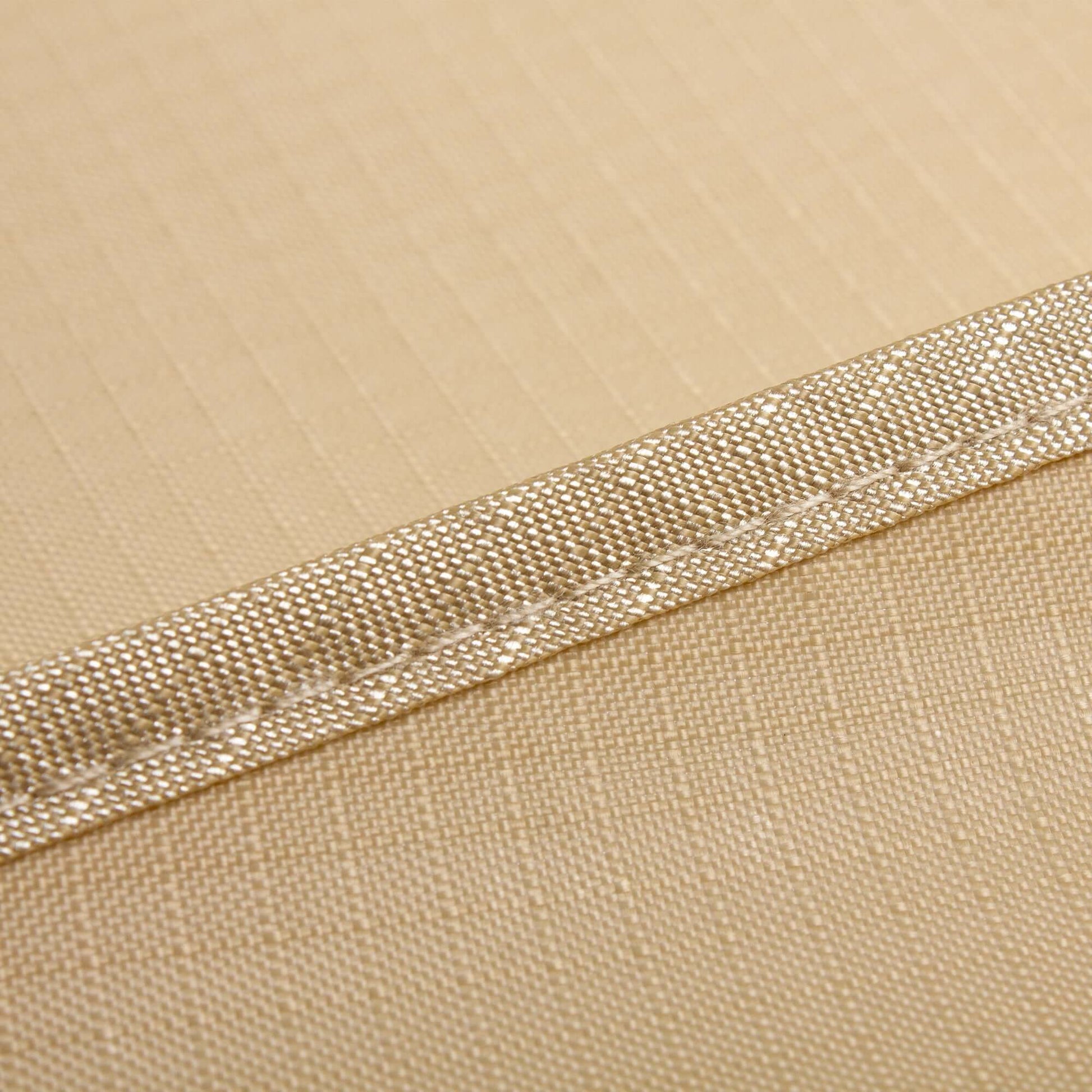 Close-up of the weatherproof, UV-resistant outdoor chaise lounge cover fabric showing durable stitching and breathable material.