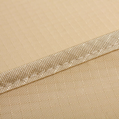 Close-up of the weatherproof, UV-resistant outdoor chaise lounge cover fabric showing durable stitching and breathable material.